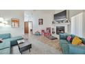 Spacious living room with fireplace and tile floors, perfect for entertaining or relaxing at 876 W El Monte Pl # 3, Chandler, AZ 85225