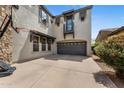 Spacious three car garage featuring a basketball hoop, with a second-story balcony overlooking the driveway at 9285 E Canyon Vw, Scottsdale, AZ 85255
