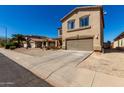 Charming two-story home with a two-car garage and well-maintained landscaping at 1472 E Avenida Kino --, Casa Grande, AZ 85122