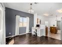 Bright open plan with hardwood floors and a light-filled office space at 1472 E Avenida Kino --, Casa Grande, AZ 85122