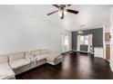 Spacious living area with hardwood floors, a comfortable sectional, and ample natural light at 1472 E Avenida Kino --, Casa Grande, AZ 85122