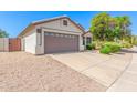 Charming home with a well-manicured front yard, mature landscaping, and a two-car garage at 1701 E Countrywalk Ln, Chandler, AZ 85225