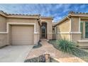 Inviting front entrance with a stone pathway and a decorative 'hello' sign on the front door at 1893 W Canary Way, Chandler, AZ 85286