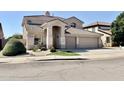 Lovely two-story home showcasing a well-kept front yard and neutral color palette at 2461 E Binner Dr, Chandler, AZ 85225