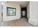 Entryway featuring a dark door with sleek, modern design at 28341 N 112Th Way, Scottsdale, AZ 85262