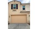 Two car garage and home exterior with classic shutters and desert color palette at 4077 S Sabrina Dr # 94, Chandler, AZ 85248