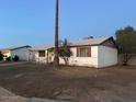 A single-story residence with a classic design, set against a clear sky at 4301 N 72Nd Ln, Phoenix, AZ 85033