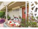 Cozy front porch featuring potted plants, decorative ironwork, and a secure gated entry at 6118 N 12Th Pl # 2, Phoenix, AZ 85014