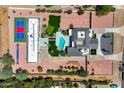 Spacious home with tennis court, pool, multiple patios, immaculate landscaping, and lush greenery at 10620 N 84Th St, Scottsdale, AZ 85260
