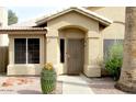 Inviting front entrance with desert landscaping, a secure door, and a walkway leading to the front door at 1132 E Harbor View Dr, Gilbert, AZ 85234