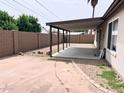 Spacious backyard featuring a covered patio area and block wall fencing at 17635 N 22Nd St, Phoenix, AZ 85022