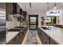 Stylish kitchen with stainless appliances, range, and center island, great lighting, and views at 37200 N Cave Creek Rd # 2108, Scottsdale, AZ 85262