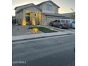 Well-maintained two-story home with manicured front yard and ample parking on a quiet street at 4152 S 249Th Dr, Buckeye, AZ 85326