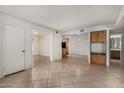 A tiled living room leads to the dining area, kitchen, and a full bath at 839 S Westwood St # 164, Mesa, AZ 85210