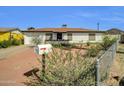 Quaint single-story home with tidy desert landscaping, a mailbox, and a paved driveway at 10245 N 15Th Dr, Phoenix, AZ 85021