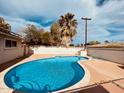 Inviting backyard pool surrounded by a well-maintained patio and mature landscaping at 1257 E Dartmouth St, Mesa, AZ 85203