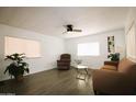 Bright living room with modern flooring, neutral walls and an abundance of natural light at 1524 E 23Rd Ave, Apache Junction, AZ 85119