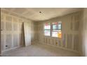Bedroom with a large window and ample wall space for furniture and decoration at 15777 W Cheryl Dr, Waddell, AZ 85355