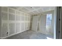 This bedroom features drywall, natural light from the window and a closet at 15777 W Cheryl Dr, Waddell, AZ 85355