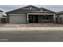 Charming single-story home with a two-car garage and well-maintained landscaping at 15777 W Cheryl Dr, Waddell, AZ 85355