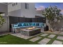 Back yard with custom stone seating area and fire pit perfect for outdoor entertaining at 15837 N 74Th Ln, Peoria, AZ 85382