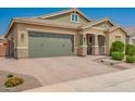 Beautiful home featuring a two-car garage, desert landscaping, and a paved driveway at 16064 W Montana De Oro Dr, Surprise, AZ 85387