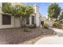Charming home featuring a well-maintained gravel yard and lush tree providing ample shade at 1717 E Union Hills Dr # 1110, Phoenix, AZ 85024