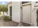 Close-up view of a secure front door with a decorative security screen and inviting welcome mat at 1717 E Union Hills Dr # 1110, Phoenix, AZ 85024