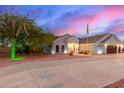 Well-maintained home with vibrant desert landscaping and a spacious driveway, creating an inviting curb appeal at 23040 W Hammond Ln, Buckeye, AZ 85326