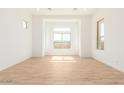 Bright and airy living room with large windows offering ample natural light at 2636 E Virginia St, Mesa, AZ 85213