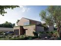 Contemporary house featuring a stone base, wood accents, and desert-style landscaping at 3828 E Monterosa St, Phoenix, AZ 85018