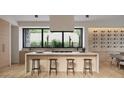 Bright, modern kitchen with a large island, sleek countertops, and wine rack display at 3828 E Monterosa St, Phoenix, AZ 85018