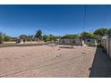 Large backyard area features low-maintenance desert landscaping, a fence, and alley access at 4518 N 8Th Pl, Phoenix, AZ 85014