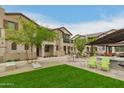 Inviting backyard with outdoor seating, green space, and lush landscaping at 4657 S Vapor --, Mesa, AZ 85212