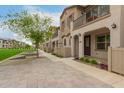 Exterior view of attractive townhomes with landscaped walking areas and grass at 4657 S Vapor --, Mesa, AZ 85212