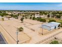 Large horse property with riding arena, fencing, and storage shed at 51089 W Julie Ln, Maricopa, AZ 85139