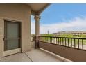 Balcony with column and partial view of landscaping and buildings at 5450 E Deer Valley Dr # 3023, Phoenix, AZ 85054