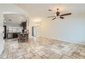 Spacious living room with tile flooring flowing into an open concept kitchen at 8137 E Indianola Ave, Scottsdale, AZ 85251
