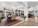 Open concept dining and living room featuring tile flooring, high ceilings, and neutral paint at 8817 S 18Th Way, Phoenix, AZ 85042