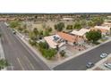 A wide aerial view shows a beautiful two-story home and the surrounding neighborhood at 9509 W Tonopah Dr, Peoria, AZ 85382