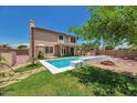 Private backyard oasis with pool, fire pit, outdoor grill, and covered patio, ideal for outdoor living at 9509 W Tonopah Dr, Peoria, AZ 85382
