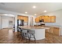 Spacious kitchen with a large island, granite countertops, and stainless steel appliances at 9722 W Prospector Dr, Queen Creek, AZ 85144
