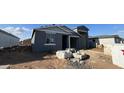 New construction home with gray exterior and attached two-car garage at 15790 W Cheryl Dr, Waddell, AZ 85355
