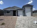 Charming single-Gathering home with a large three-car garage and low-maintenance landscaping at 15790 W Cheryl Dr, Waddell, AZ 85355