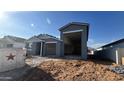 New home showing a gray exterior with a spacious two-car garage at 15790 W Cheryl Dr, Waddell, AZ 85355