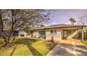 The home features a well-maintained lawn and covered parking with a beautiful tree at 2823 N 69Th Pl, Scottsdale, AZ 85257