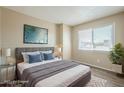 Serene bedroom with a plush bed, soft lighting, and a calming color palette for relaxation at 4614 E Pueblo Ave, Phoenix, AZ 85040