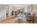 Inviting living area featuring stylish furnishings, a decorative rug, and access to the outdoors at 4727 E Lafayette Blvd # 117, Phoenix, AZ 85018