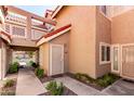 Inviting entrance with decorative door, rock landscaping, and a well-manicured walkway at 1633 E Lakeside Dr # 25, Gilbert, AZ 85234