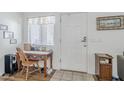 Bright entryway featuring tile flooring, a desk, and a conveniently located front door at 1718 W Colter St # 184, Phoenix, AZ 85015